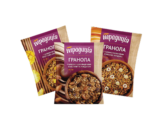 Гранола з тропічними фруктами, карамелізованими горіхами фундука, з шоколадними краплями та мигдалем, 40 г Традиція™
